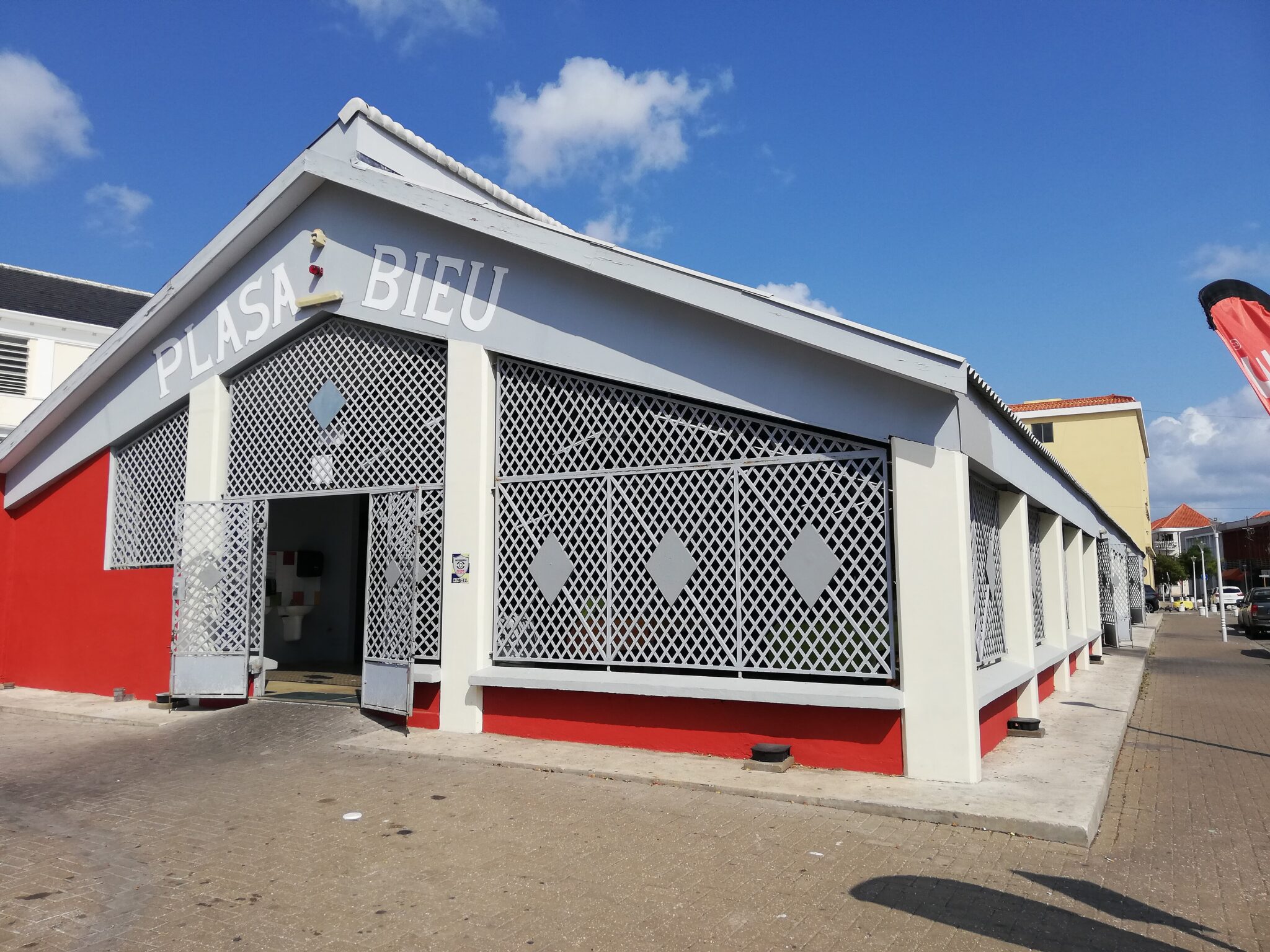 The white and red Plasa Bieu old market hall in Punda, Willemstad, Curaçao